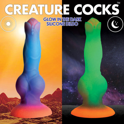 Glow-in-the-dark silicone alien dildo with vibrant blue, purple, and orange hues by day and glowing green by night.