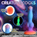 Colorful silicone alien-themed dildo with strong suction base, tapered tip, and glow-in-the-dark feature against a cosmic background.