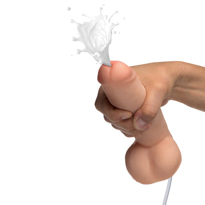 Hand holding an 8-inch realistic dual density dildo with squirting feature and fluid ejecting from the tip.