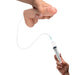 Hand holding a realistic 8-inch dual density dildo connected to a syringe for squirting fluid.