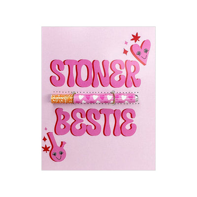 Pink greeting card with "Stoner Bestie" text and a heart-patterned one hitter pipe attached.
