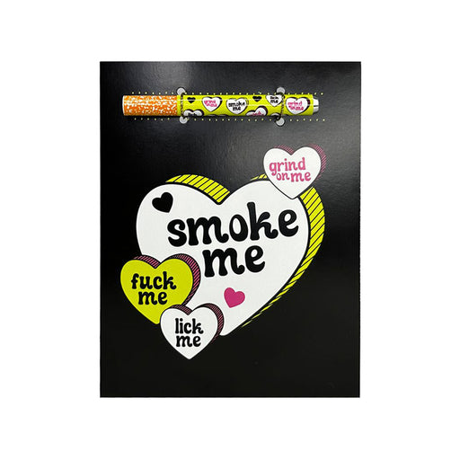 Black greeting card with colorful hearts and bold playful text, including a matching one-hitter pipe attached at the top.