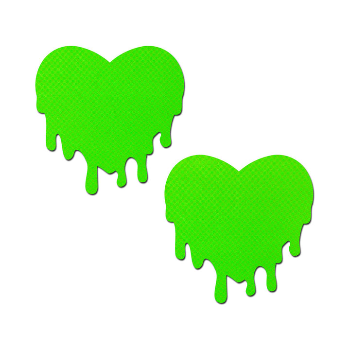 Pair of neon green heart-shaped nipple pasties with a melting drip design and subtle glitter texture on white background.
