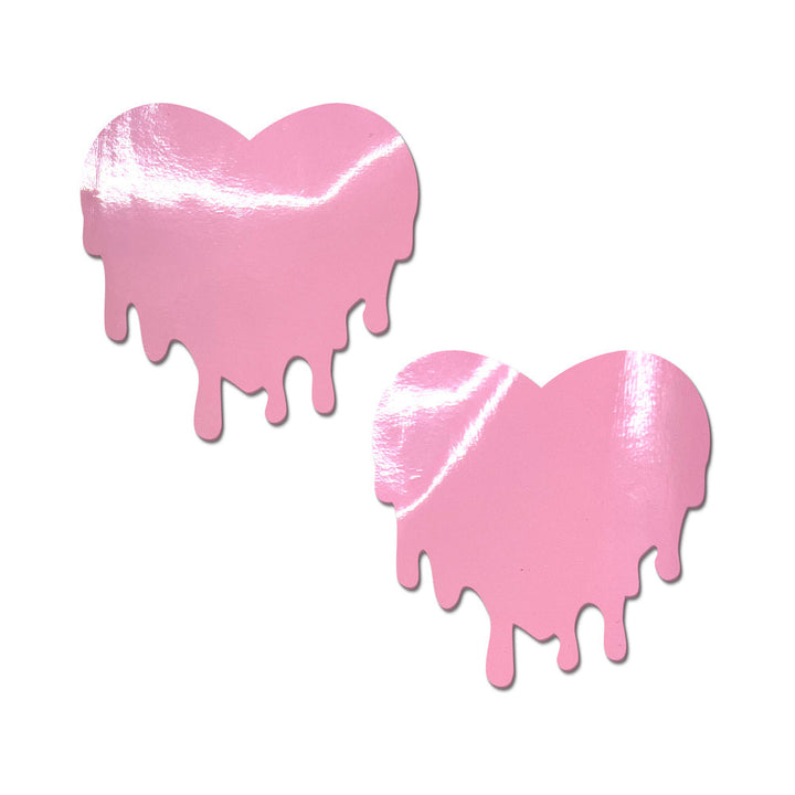 Pair of baby pink faux latex nipple pasties shaped like melting hearts with a glossy finish.