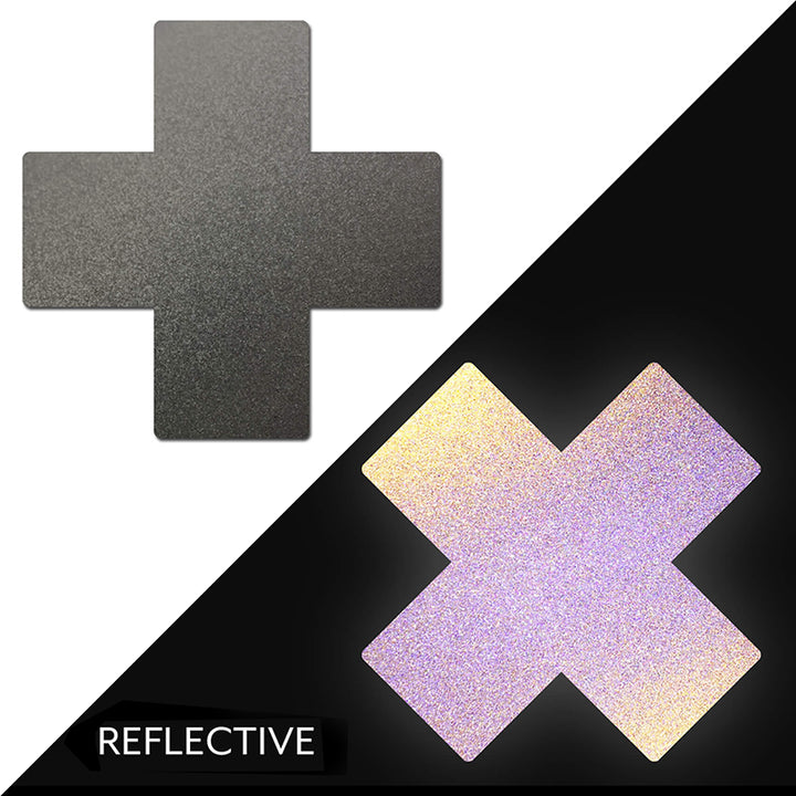 Reflective gun metal grey cross-shaped nipple pasties shown in normal and glowing light conditions.