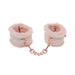 Light peach faux fur handcuffs with rose gold chain and adjustable faux leather straps for gentle restraint.