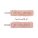 Peach-colored faux fur handcuffs with adjustable straps and rose gold chain connector on white background.
