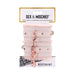 Peach-colored faux fur handcuffs with rose gold chain and hardware on branded Sex & Mischief packaging.