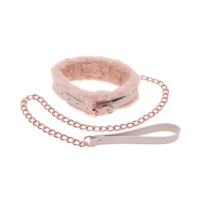 Peach-colored faux fur collar with matching rose gold chain leash and faux leather handle on white background.