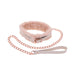 Peach-colored faux fur collar with matching rose gold chain leash and faux leather handle on white background.