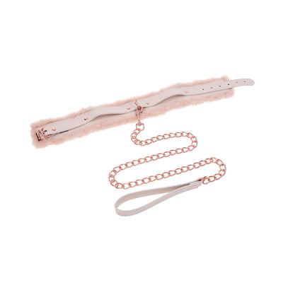 Peach-colored faux fur collar with rose gold chain leash and faux leather handle on white background.