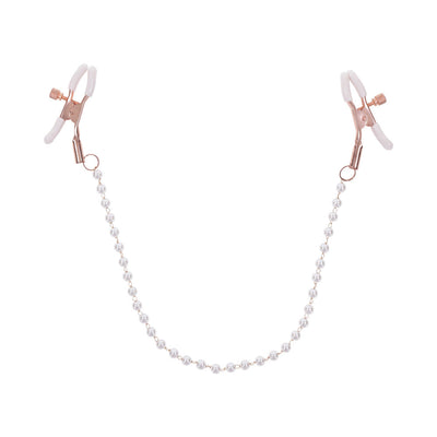 Rose gold adjustable nipple clamps connected by a faux pearl chain with white rubber tips for comfort and grip.