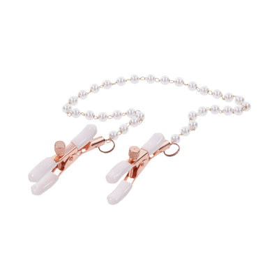 Rose gold adjustable nipple clamps with white rubber tips connected by a faux pearl chain for enhanced sensitivity.