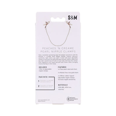 Packaging of Sandm Peaches N Creame Pearl Nipple Clamps with rose gold chain and white rubber-tipped adjustable clamps shown on front.
