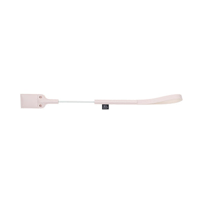 Light pink riding crop with faux leather handle and looped tip featuring a peach-shaped cutout design.