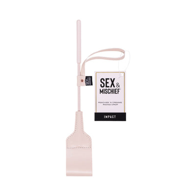 Light peach faux leather riding crop with looped tip and wrist strap, labeled Sex & Mischief Peaches 'n Creame Riding Crop.