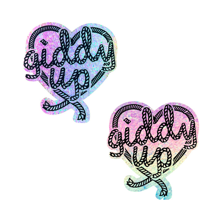 Pair of heart-shaped pastel glitter nipple pasties with black rope-style "giddy up" text design