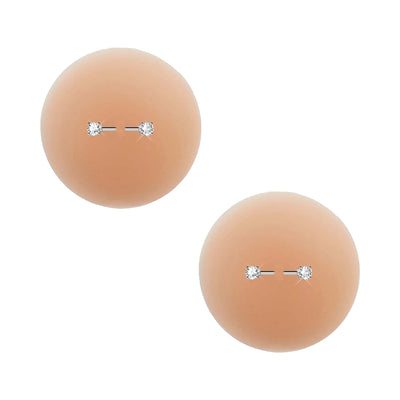 Pair of skin-tone silicone nipple pasties with diamond-like barbell piercing detail, reusable and discreet.