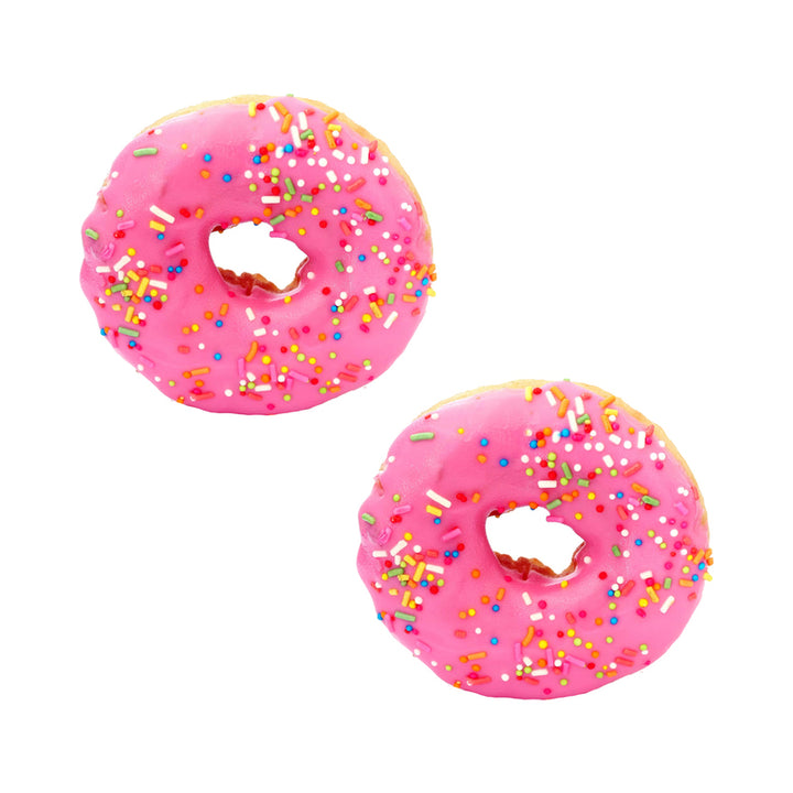 Pair of pink frosted donut-shaped edible nipple pasties with colorful sprinkles on a white background
