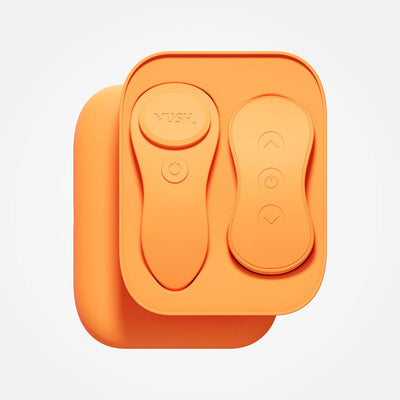 Orange VUSH Luna wearable vibrator and remote control neatly placed in a compact charging case.