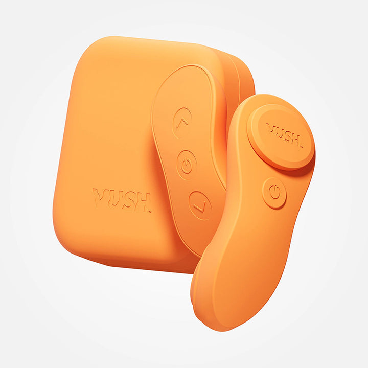 Orange VUSH Luna wearable vibrator with remote control and compact charging case on white background.