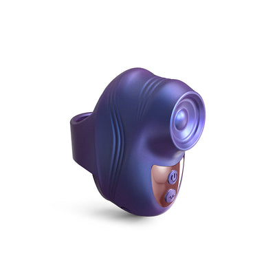 Compact purple finger-worn device with textured grip and control buttons for personalized tapping stimulation.