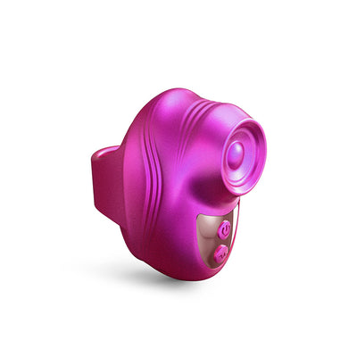 Compact pink finger-worn personal massager with textured design and control buttons on white background.