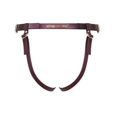 Aubergine leatherette strap-on harness with adjustable gold-tone buckles and logo detail on waistband.