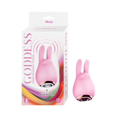 Pink silicone bunny-shaped tickler with dual ears and jeweled push button, shown with packaging.