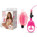 Lux Fetish Vibrating Butterfly Pussy Pump in pink with ergonomic hand pump and packaging featuring product details and model.