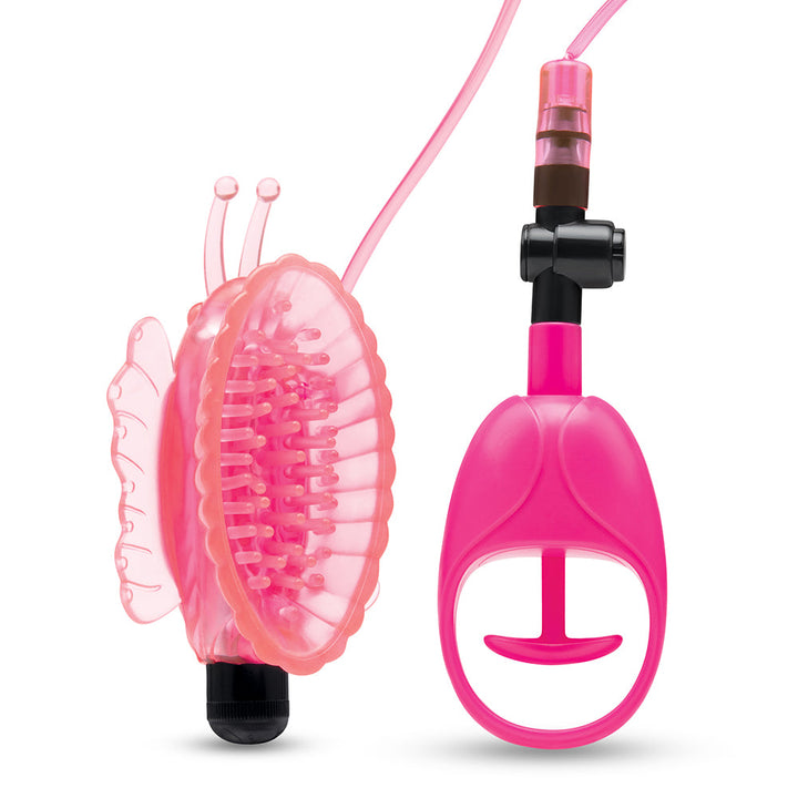 Pink butterfly-shaped vibrating pussy pump with textured interior and attached hand pump with quick-release valve.