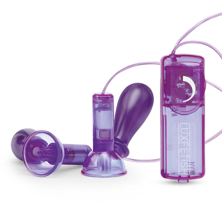 Purple Lux Fetish remote control with two vibrating nipple suckers featuring suction cups and adjustable settings.