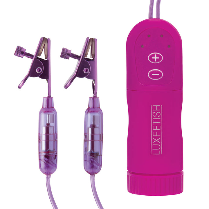 Lux Fetish purple remote control with adjustable vibrating nipple clips on white background.