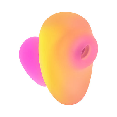 Compact ROMP Kiss clitoral suction toy in vibrant pink and coral gradient with soft silicone texture.