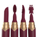 Four interchangeable Merlot-colored silicone tips for a rechargeable lipstick vibrator with gold accents.