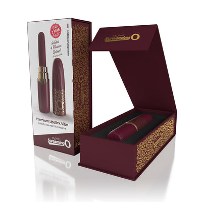 Merlot-colored rechargeable vibrating lipstick with gold leopard print in open luxury box and product packaging.