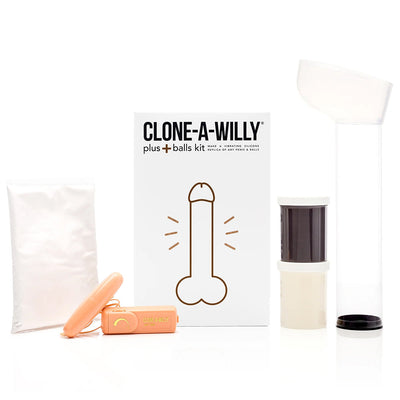 Clone-A-Willy Plus with Balls DIY kit including molding powder, silicone, vibrator, and casting tube in deep skin tone packaging.