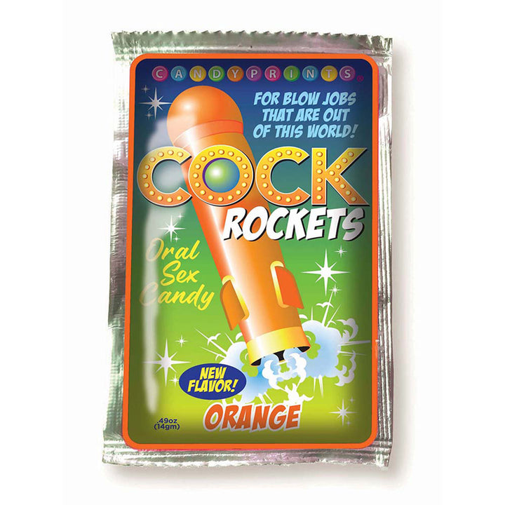 Orange-flavored Cock Rockets oral candy package with rocket graphic and playful text on green background