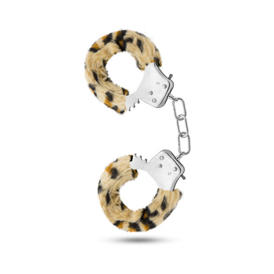 Pair of stainless steel handcuffs with removable leopard print faux fur lining and connecting chain on white background.
