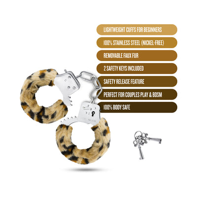 Temptasia Beginner Cuffs with leopard print removable faux fur, stainless steel construction, safety release, and two keys displayed on white background.