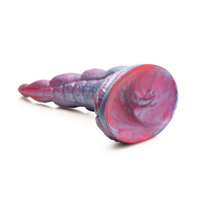 Red and blue silicone tentacle dildo with textured suckers and wide suction cup base on white background.