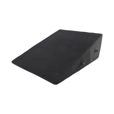 Black wedge-shaped positioner with soft fabric cover and side handles for support and comfort.