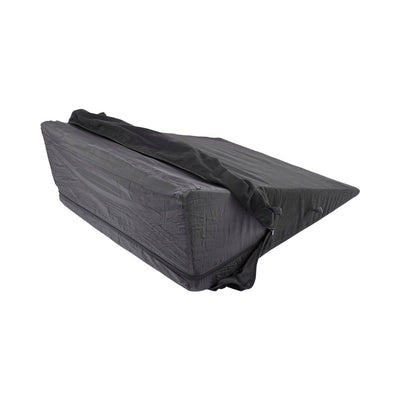 Black wedge-shaped foam positioner with a removable, washable cover and integrated webbing loops for versatile support.