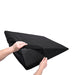 Hands removing the black machine-washable cover from the Sportsheets Pivot Positioner Plus wedge cushion.
