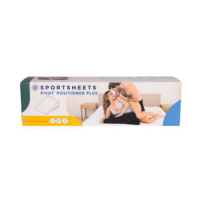 Packaging box of Sportsheets Pivot Positioner Plus showing a couple using the black foam positioning ramp on a bed.