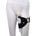 Black adjustable Sportsheets Pivot 2-in-1 Forced-O Strap worn on thigh holding a white wand vibrator.