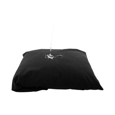 Black Sportsheets Pivot Pillow Protector with water poured on top, demonstrating its waterproof feature.