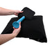 Hands demonstrating attachment of a blue accessory to the black Sportsheets Pivot Pillow Protector on a black pillow.
