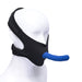 Black neoprene face strap-on harness with a blue silicone dildo attached, displayed on a white mannequin head.