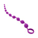 Purple silicone beaded toy with graduated spheres and a retrieval ring, designed for safe and comfortable use.